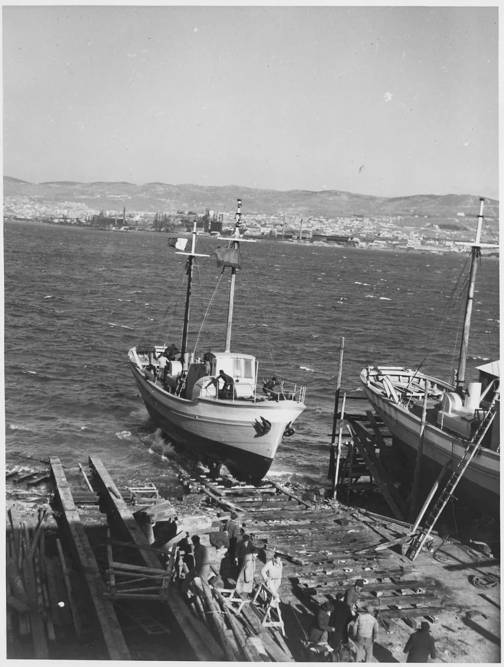 File:Italy. Here one of the ships of the Lampedusa flotilla, built with European Recovery Program aid, is launched at a... - NARA - 541725.tif