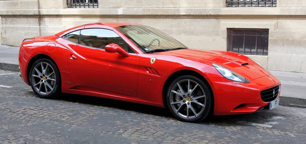 Ferrari California in a street of Paris .