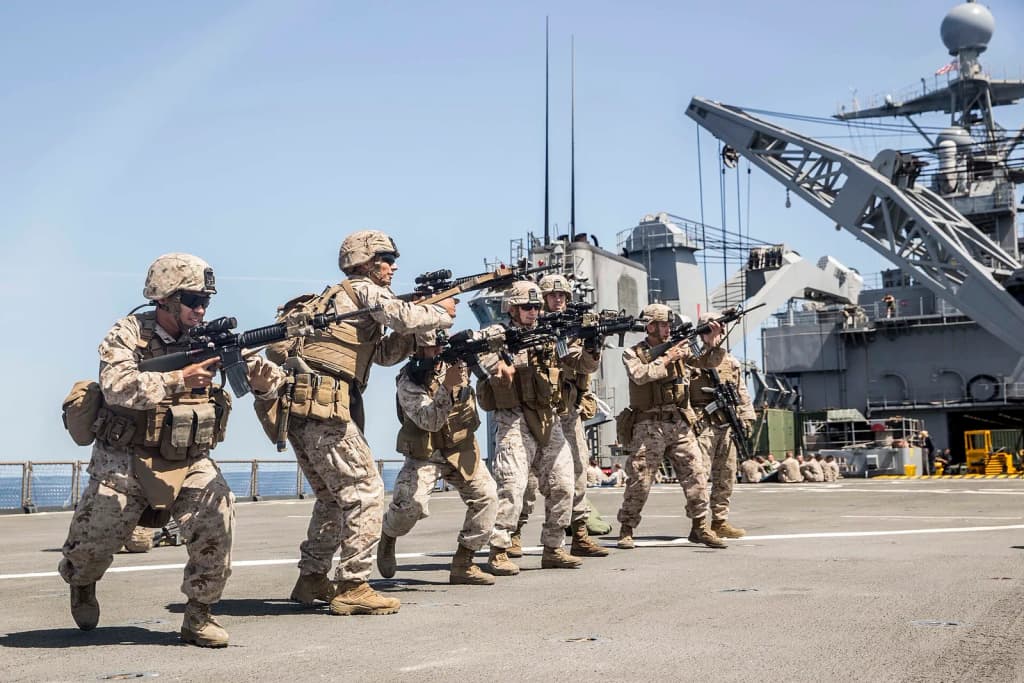 U.S. Marines with Kilo Company, Battalion Landing Team 3rd Battalion, 1st Marine Regiment, 15th Marine Expeditionary Unit, execute immediate-action drills aboar