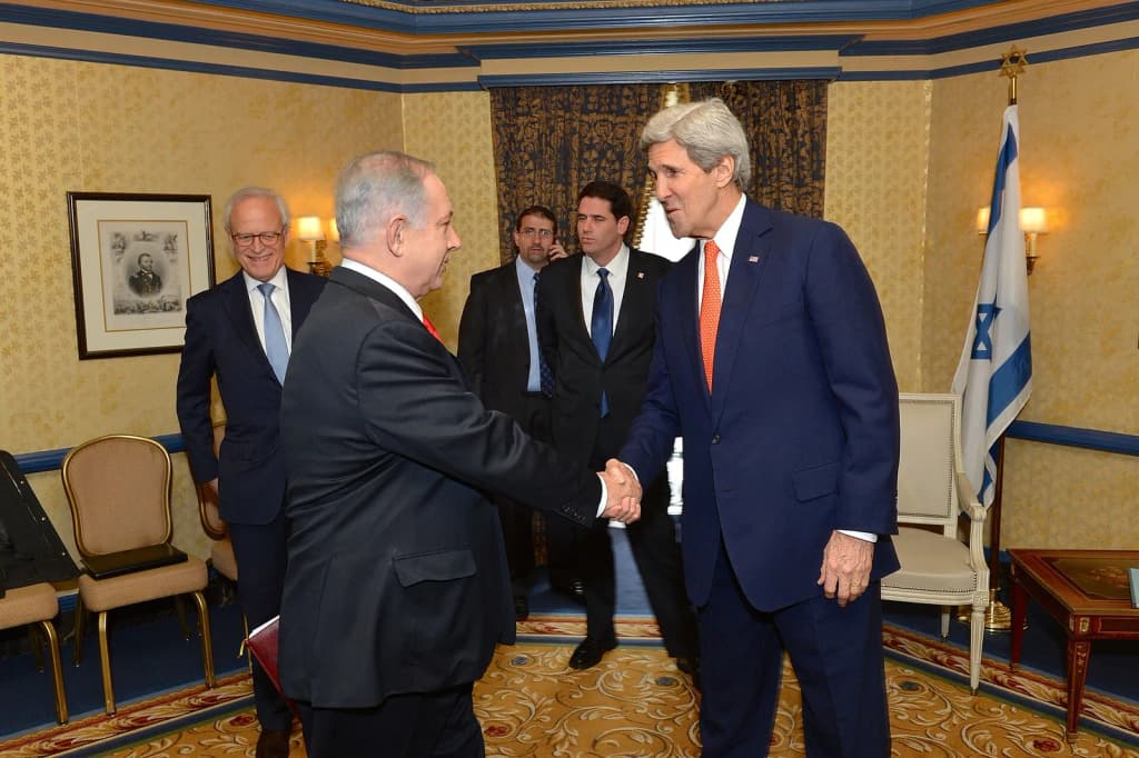 U.S. Secretary of State John Kerry shakes hands with Israeli Prime Minister Benjamin Netanyahu in Washington, D.C., on March 3, 2014. [State Department photo/ P