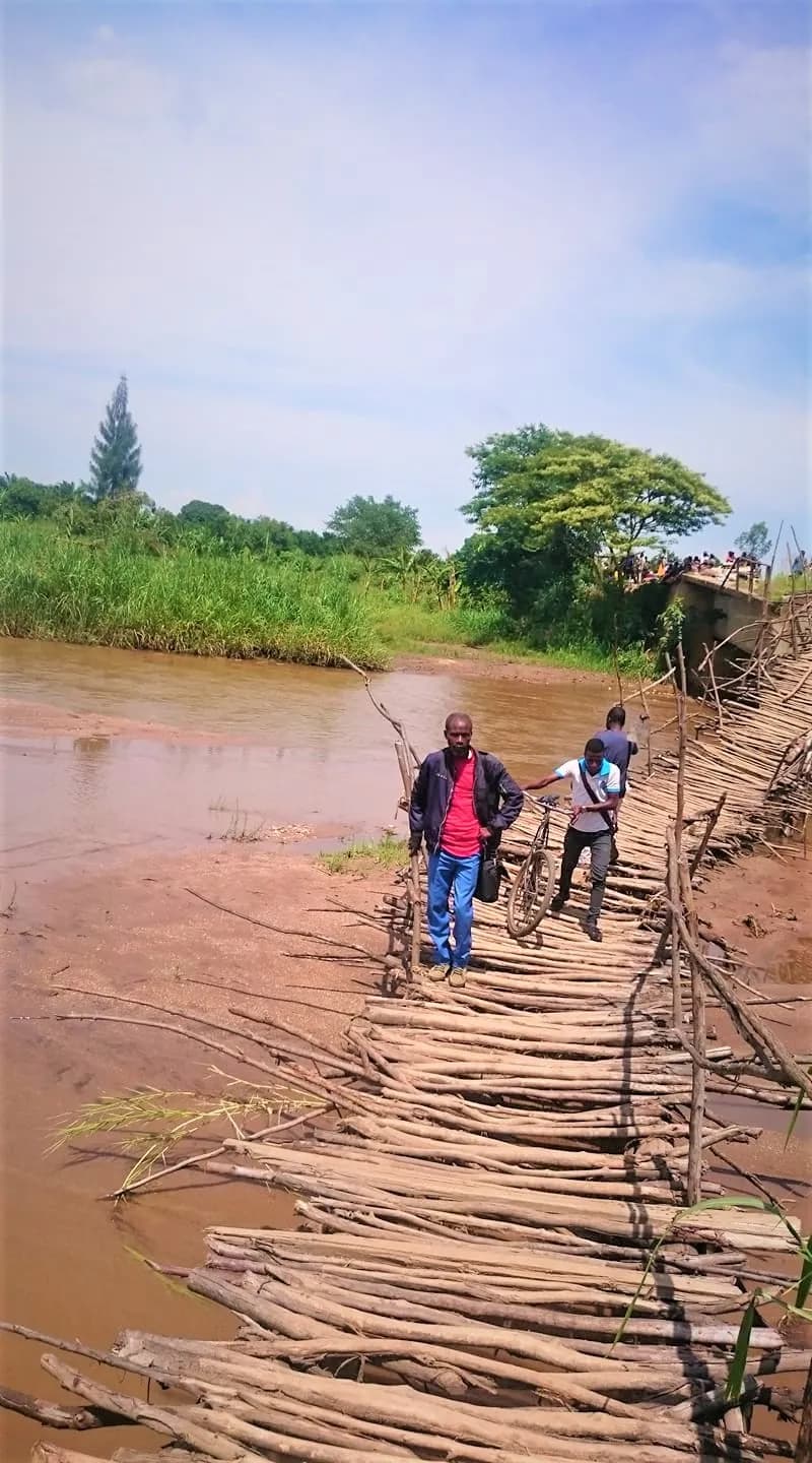 This picture captures a walkway stretching over the Sange River in the city of Sange, located in the Uvira Territory of the South Kivu Province in the Democrati