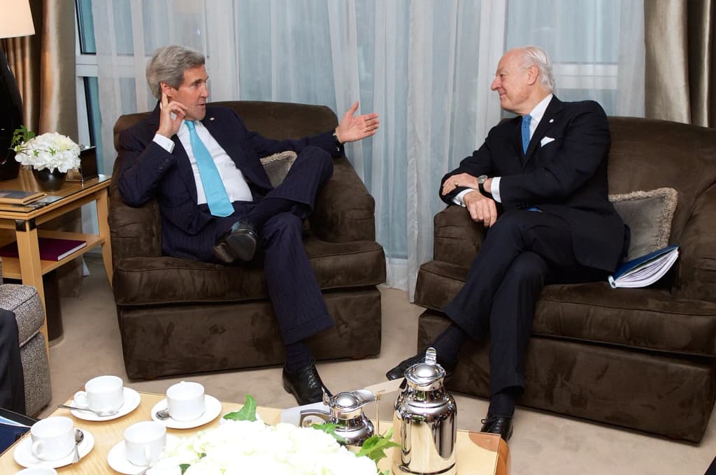U.S. Secretary of State John Kerry discusses the ongoing conflict in Syria with United Nations and Arab League Envoy to Syria Staffan de Mistura during a meetin