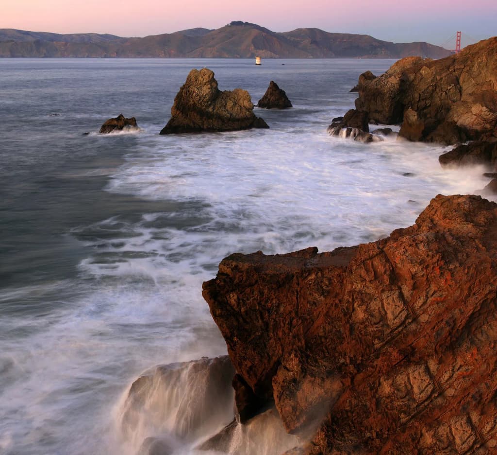 San Francisco Bay, Golden Gate Bridge and Marin Headlands at sunset.