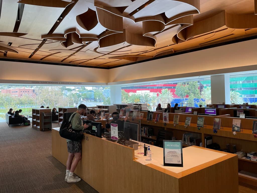 Main desk and work spaces at the West Hollywood Library. overlooking the Pacific Design Center in December 2023.