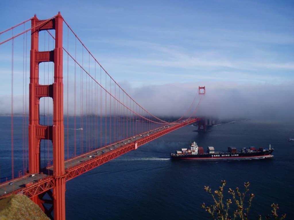 Golden Gate Bridge , San Francisco Bay, Yang Ming Line freighter YM America .