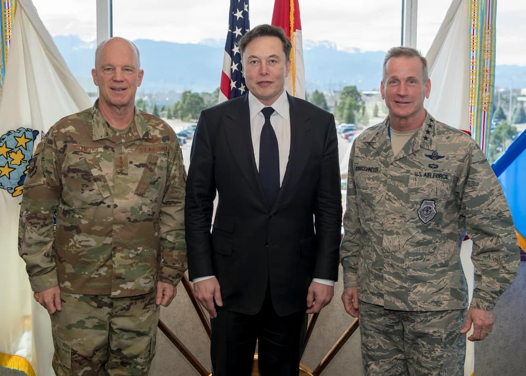PETERSON AFB, Colo. - SpaceX CEO Elon Musk (center), the Commander, Air Force Space Command, and Joint Force Space Component Commander, Gen. Jay Raymond (left),