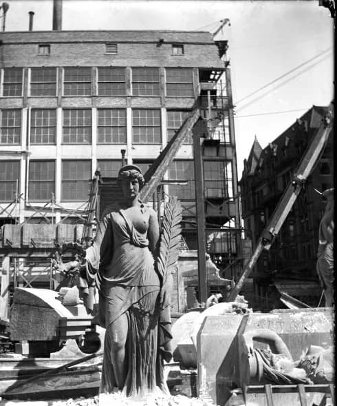 New Orleans. Peace statue removed from facade of old Cotton Exchange building during deconstruction.