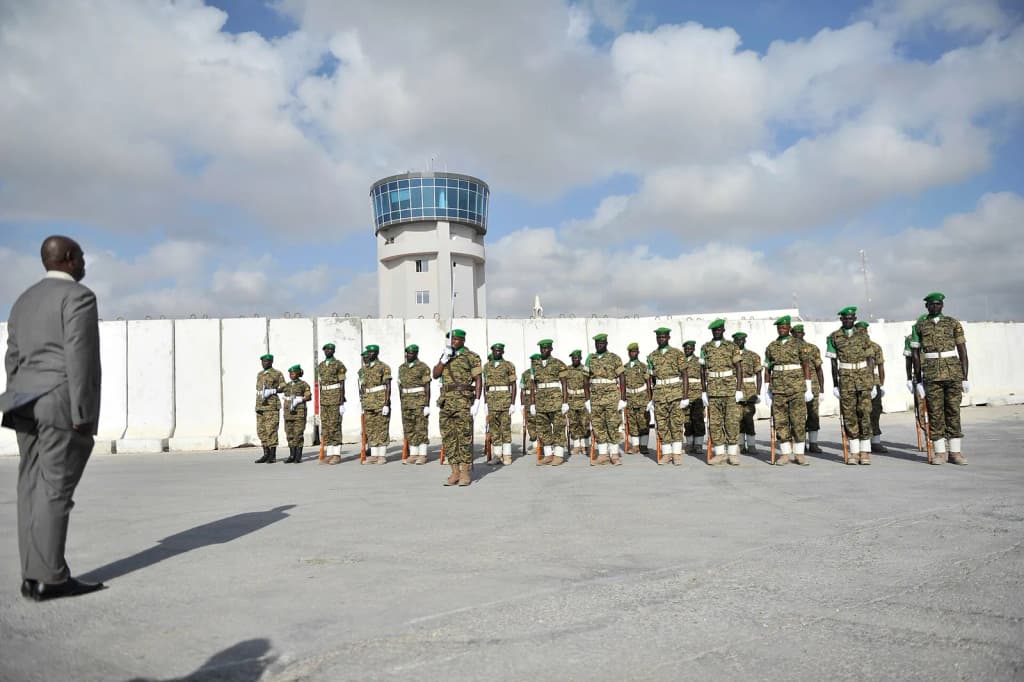 Afrian Union soldiers stand to attention during a ceremony to mark the departure of AMISOM's Force Commander, Lt. General Jonathan Rono from Mogadishu, Somalia,