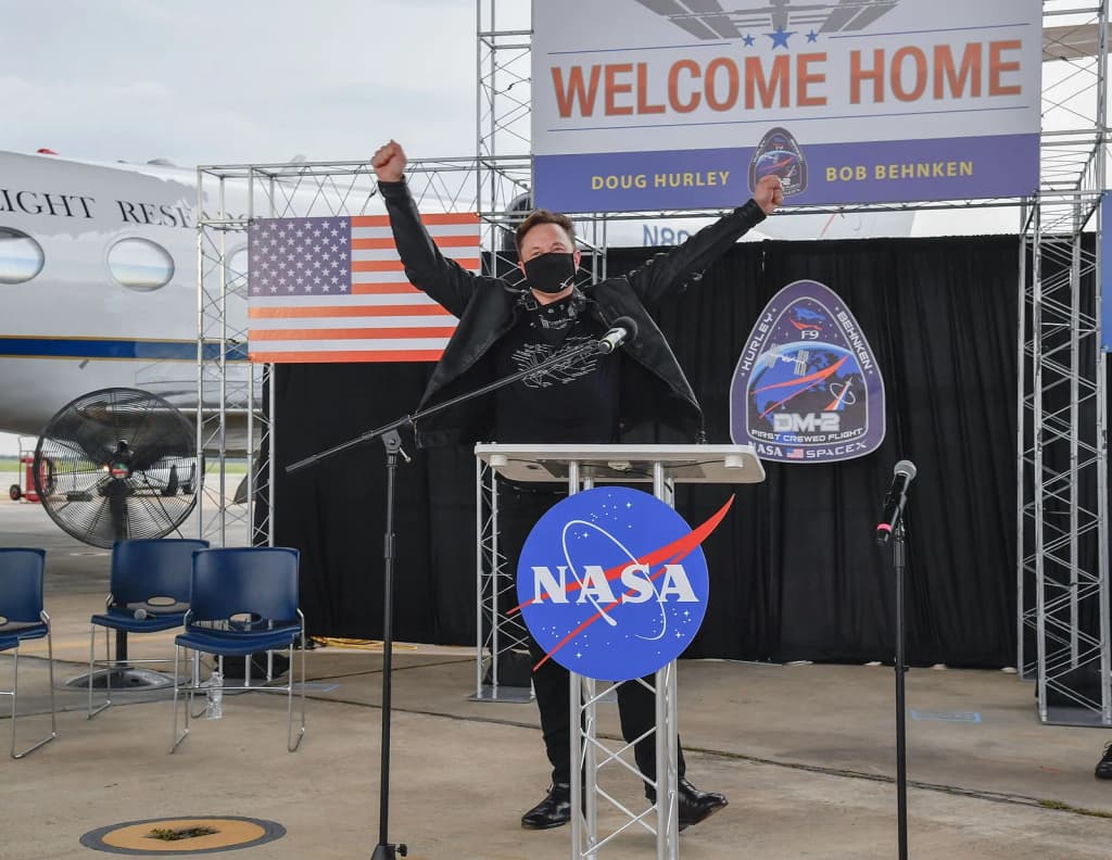 Chief Engineer of SpaceX Elon Musk celebrates the safe return of NASA astronauts Robert Behnken and Douglas Hurley during a welcome home ceremony at Ellington F