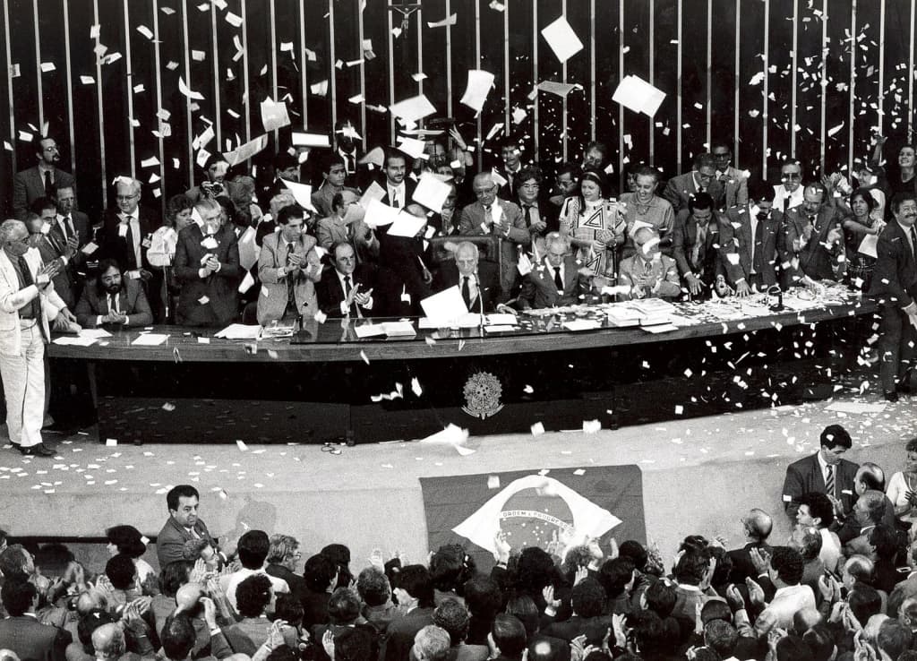 Parliamentarians in the Chamber of Deputies of the National Congress , in Brasília , commemorating the promulgation of the Constitution of Brazil , in 1988.