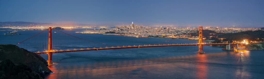 The Golden Gate Bridge and San Francisco as seen from Hawk Hill during blue hour.