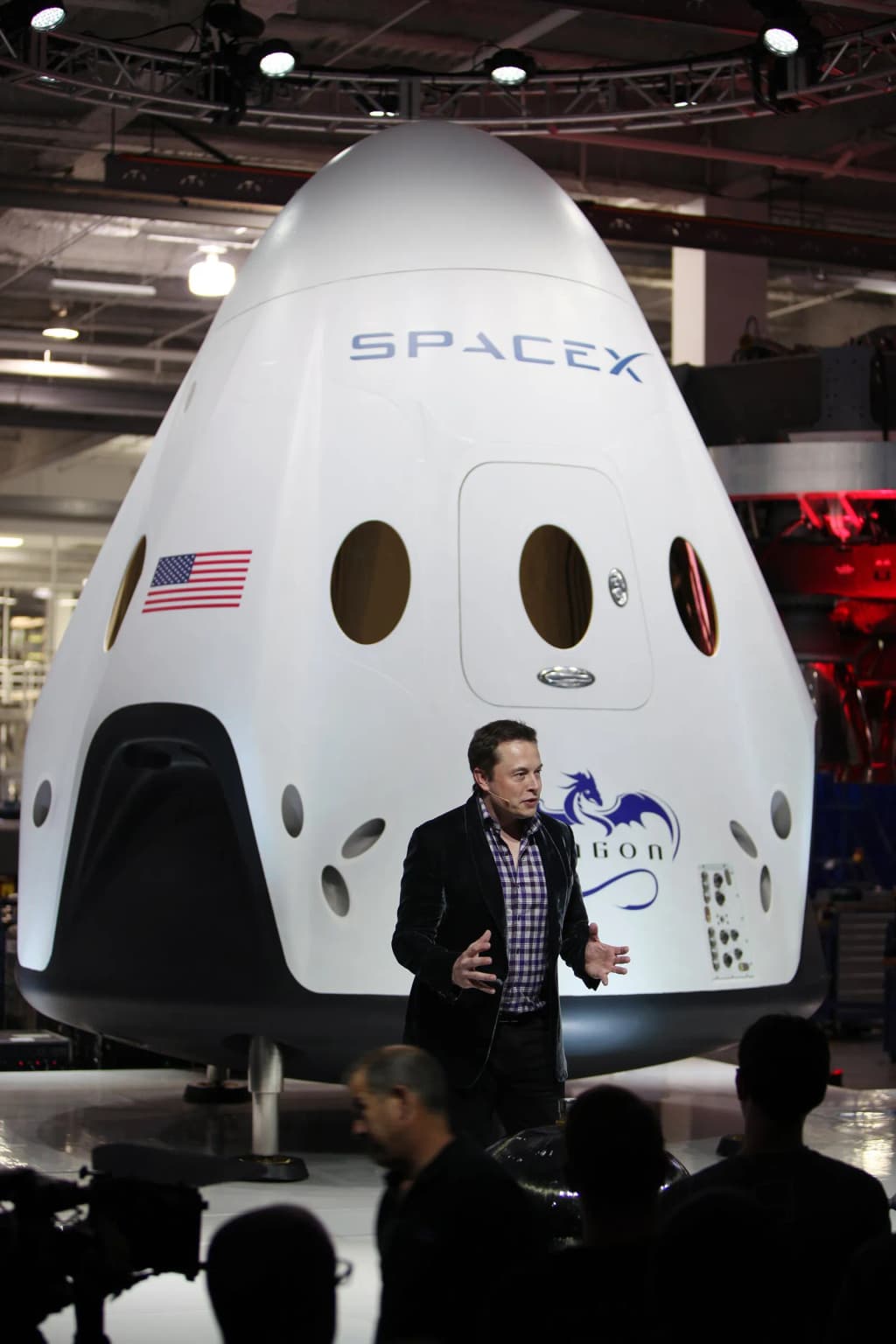 SpaceX CEO and founder Elon Musk unveils the Dragon V2 during a ceremony for the new spacecraft inside SpaceX headquarters in Hawthorne, Calif. The spacecraft i