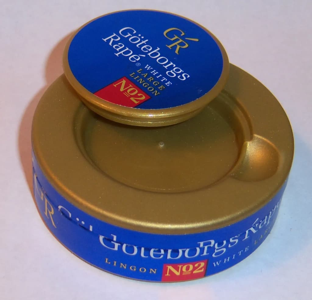 Snus can, showing open "ashtray" lid, used for spent portions.