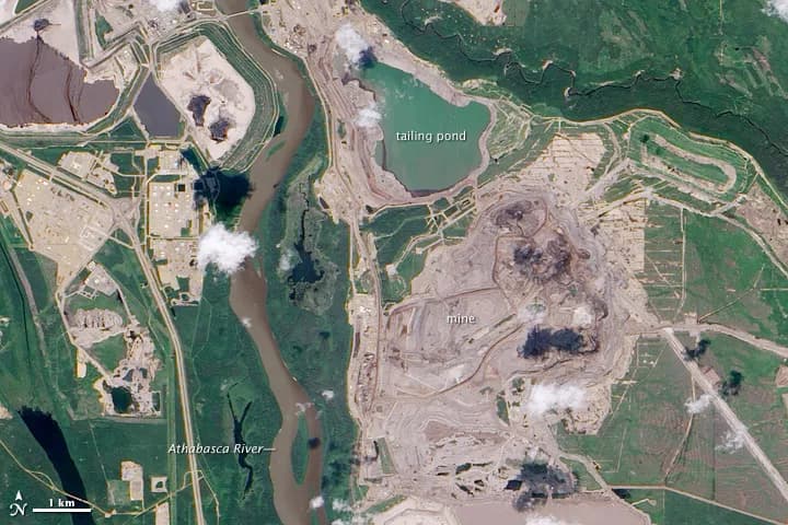 Athabasca Oil Sands NASA Earth Observatory image by Jesse Allen and Robert Simmon using EO-1 ALI data courtesy of the NASA EO-1 team. Caption by Holli Riebeek.
