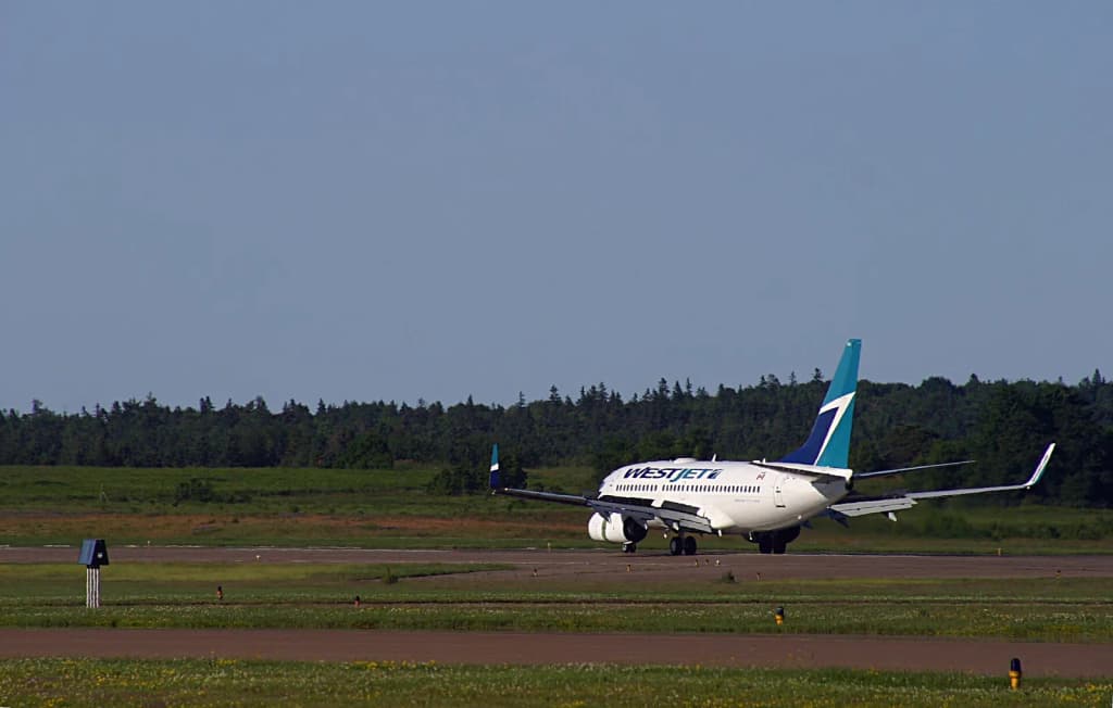 With the Spoilers up, and the Thrust Reversers uhhhh, reversing.