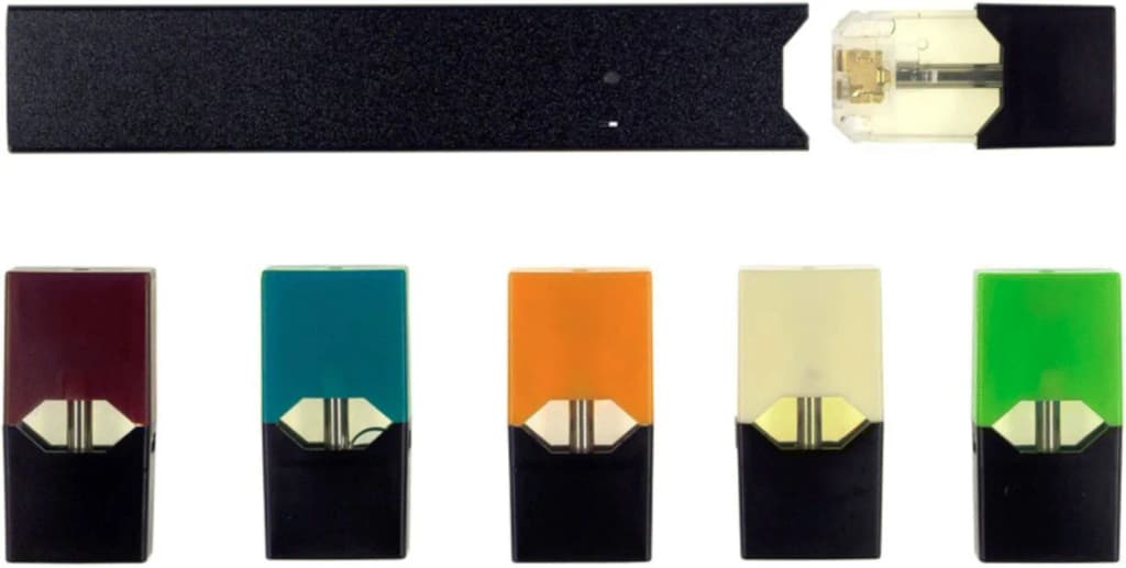 Photography of a JUUL e-cigarette with a battery and differently flavored pods