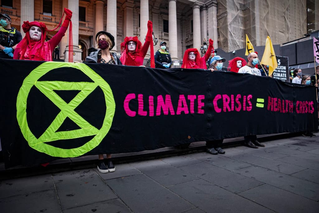 Healthcare workers die-in at the front of the Victorian Parliament, part of Day 1 of Extinction Rebellion's Autumn Rebellion in Melbourne. Support my work: <